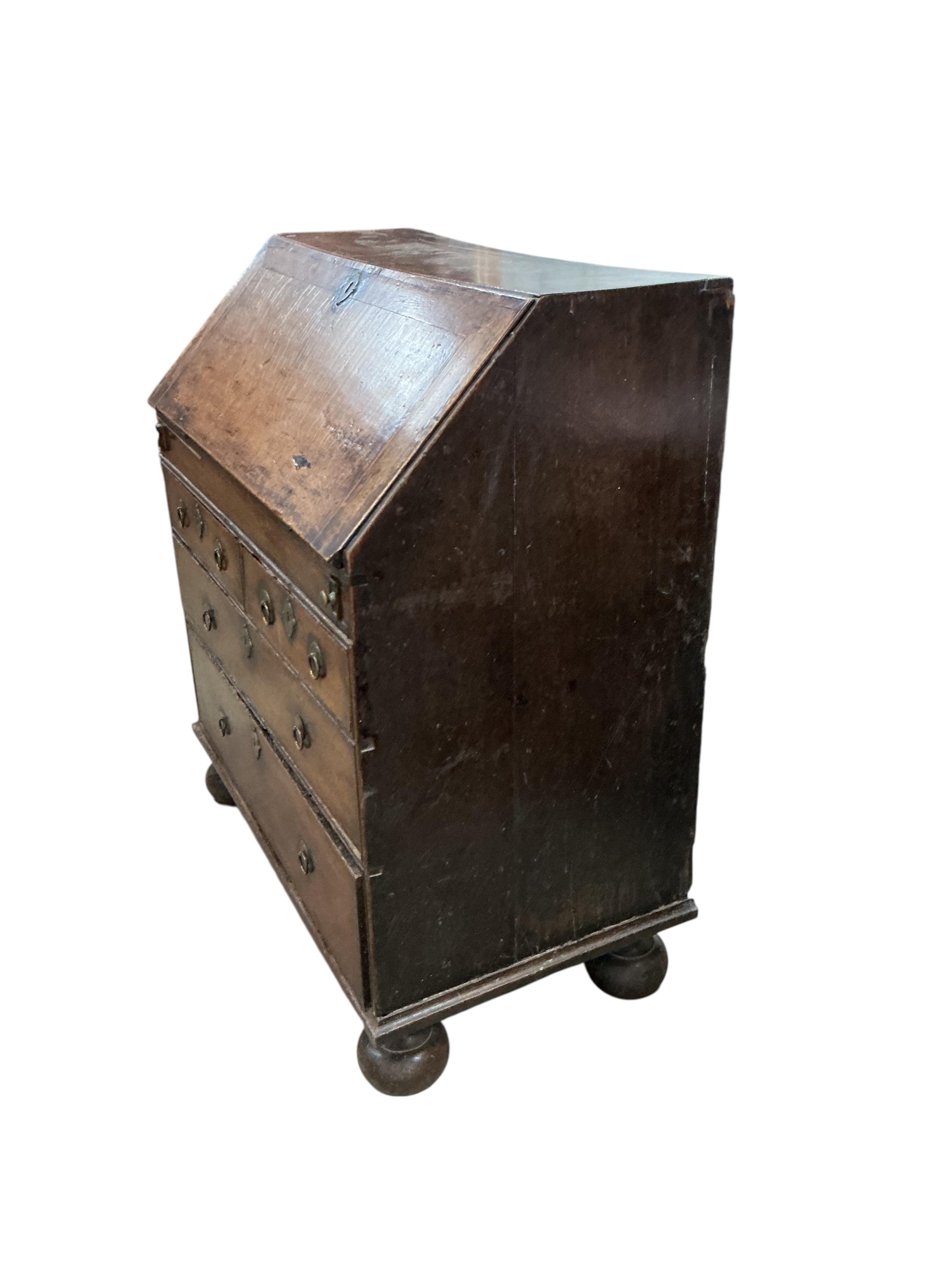 A mid 18th century oak bureau, width 86cm, depth 50cm, height 101cm